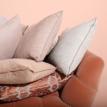 When the Eclectic, Geometric and Modern pillows meet the refined elegance of the ESSEX Rare Armchair in a soft orange color scheme, your home decor will be ready to bring Summer feelings indoors.